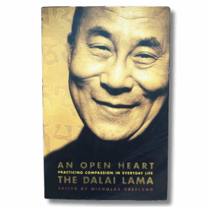 Cover of “An Open Heart: Practicing Compassion in Everyday Life” by the Dalai Lama, featuring a warm close-up portrait of the Dalai Lama smiling against a golden patterned background.