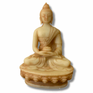A small seated Buddha statue in natural stone colour, cross-legged in meditation posture with hands resting gently in the lap, placed against a soft neutral background.