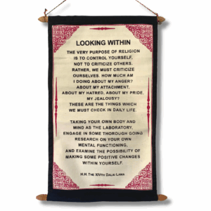 A vertical wall-hanging scroll printed on cream jute-cotton, mounted between two wooden rods, with decorative borders and a Dalai Lama quote about “looking within” displayed on textured parchment-style fabric.