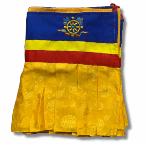 Tibetan shambu ruffled banner in yellow brocade with blue, red, and yellow borders and embroidered Dharma wheel, used for shrine and altar decoration.