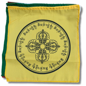 A photo of a yellow and green double vajra prayer flag with Tibetan script and a geometric pattern in the centre.