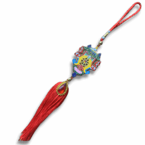 Colourful Tibetan auspicious symbols hanging charm with red braided cord and long tassel, featuring intricate enamel detailing and a central golden medallion for protection and good fortune.