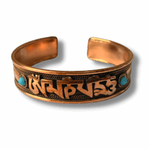 Handcrafted copper-tone Tibetan mantra cuff bracelet engraved with the Om Mani Padme Hum script and accented with small turquoise stones on each side.