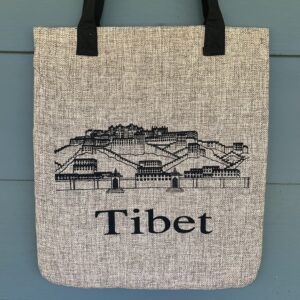 A cotton tote bag with 'TIBET' printed in large letters and a graphic of the Potala Palace on the front.