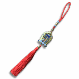 Kalachakra symbol hanging charm with red braided cord and tassel, crafted in lightweight metal with colourful enamel detailing, ideal for bags, car mirrors or sacred spaces.