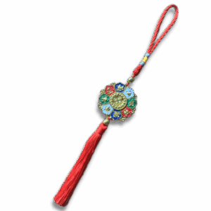 Colourful lotus-shaped auspicious symbols hanging charm with red braided cord and tassel, featuring a central golden medallion surrounded by traditional Tibetan symbols for luck and protection.