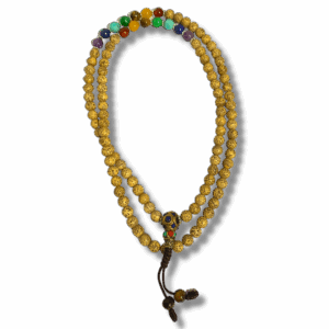 Buddhist mala made from lotus seed beads with seven chakra gemstone accents and decorative guru bead, used for meditation and mantra recitation.