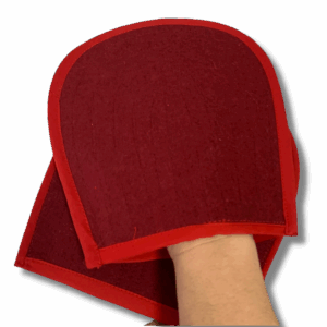 Red padded Buddhist prostration glove with velvet finish, shown worn on hand for ritual practice.