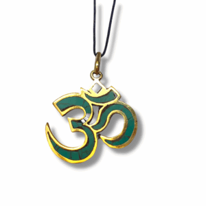 Gold-trimmed Sanskrit Om pendant inlaid with green stone, hanging from a black cord on a white background.