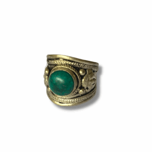 Handcrafted Tibetan-style silver-tone cuff ring with a large round turquoise-coloured stone set in an ornate filigree band, photographed on a white background.
