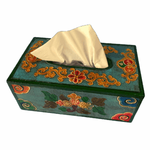 Hand-painted Tibetan style wooden tissue box holder in teal blue with embossed floral motifs and gold detailing, featuring a tissue protruding from the top opening.