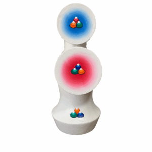 A handpainted, multicolored ritual cake (torma) made of wood, traditionally used during Buddhist rituals, with a white base and jewel design.